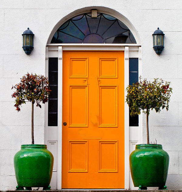 yellow-front-door-green-flower-pots